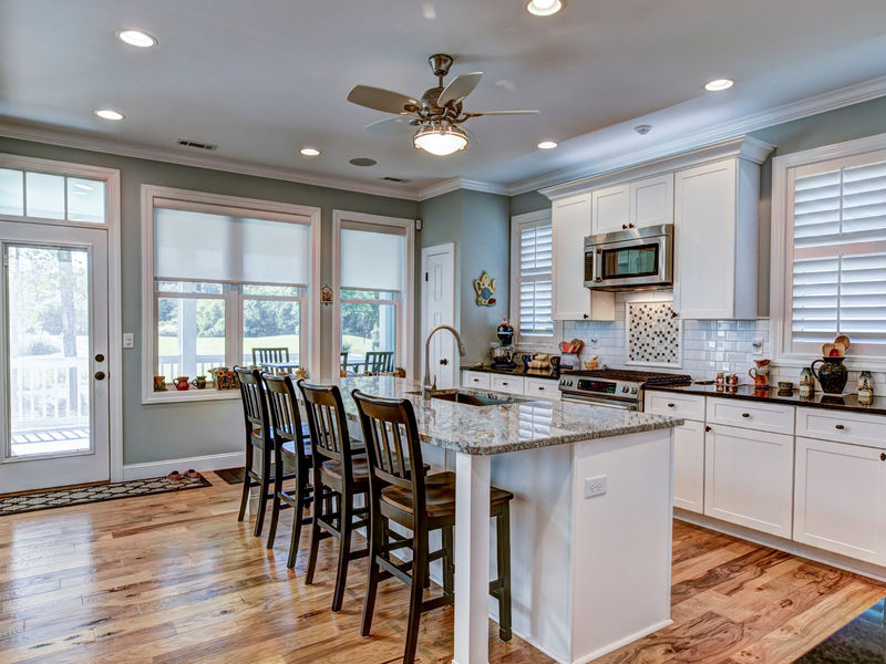 Freshly painted bright kitchen interior with white cabinets