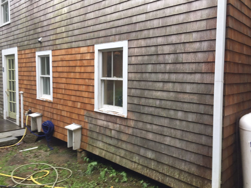 Deck being professionally pressure washed clean